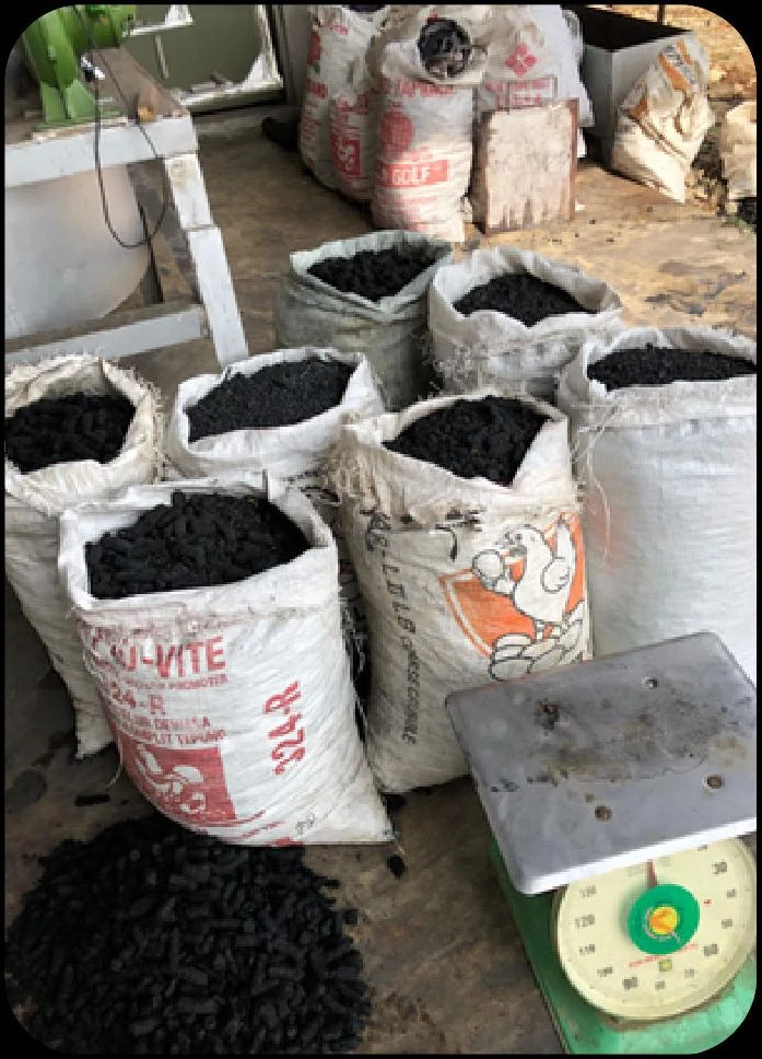 Sacks of biochar beside a weighing scale